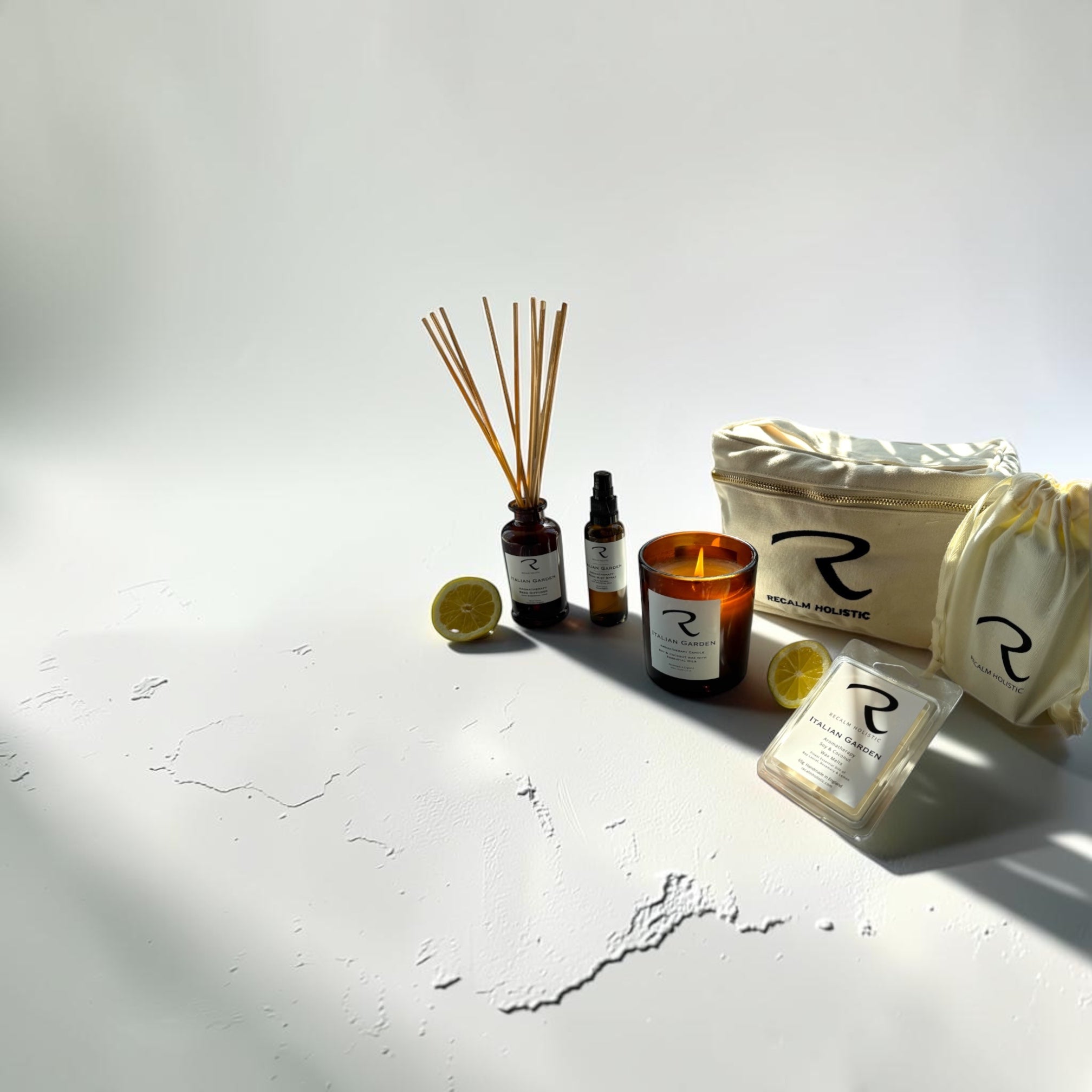 Hand-poured natural aromatherapy candles in amber glass jars on a minimalist surface, showcasing clean vegan soy and coconut wax blends