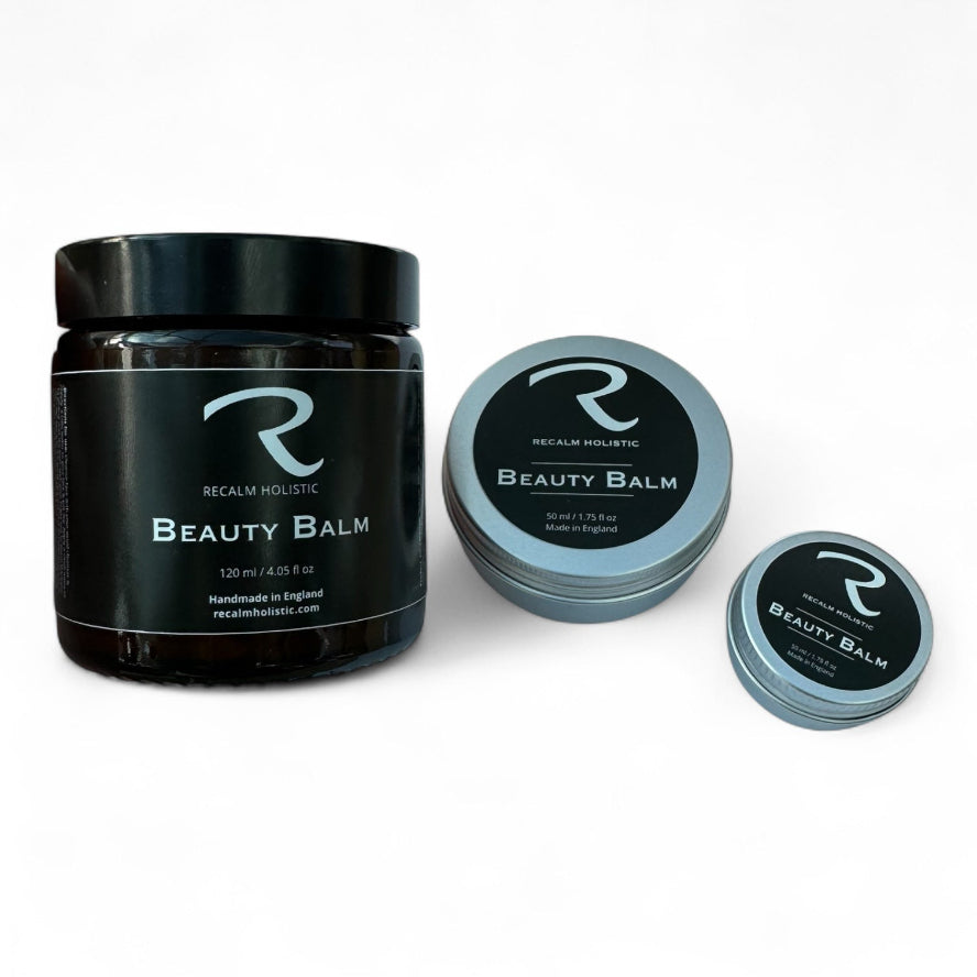 Three containers of Recalm Holistic Beauty Balm on a white background