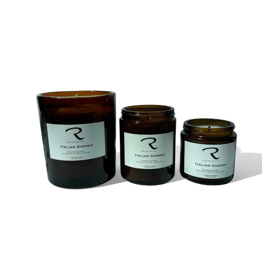 Three candles of different sizes with labels on a white background