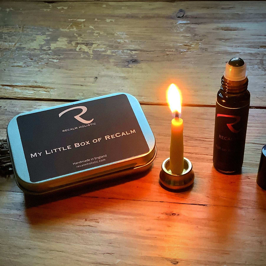 Little portable tin of mini beeswax candles for mindful moments with pulse points aromatherapy oil