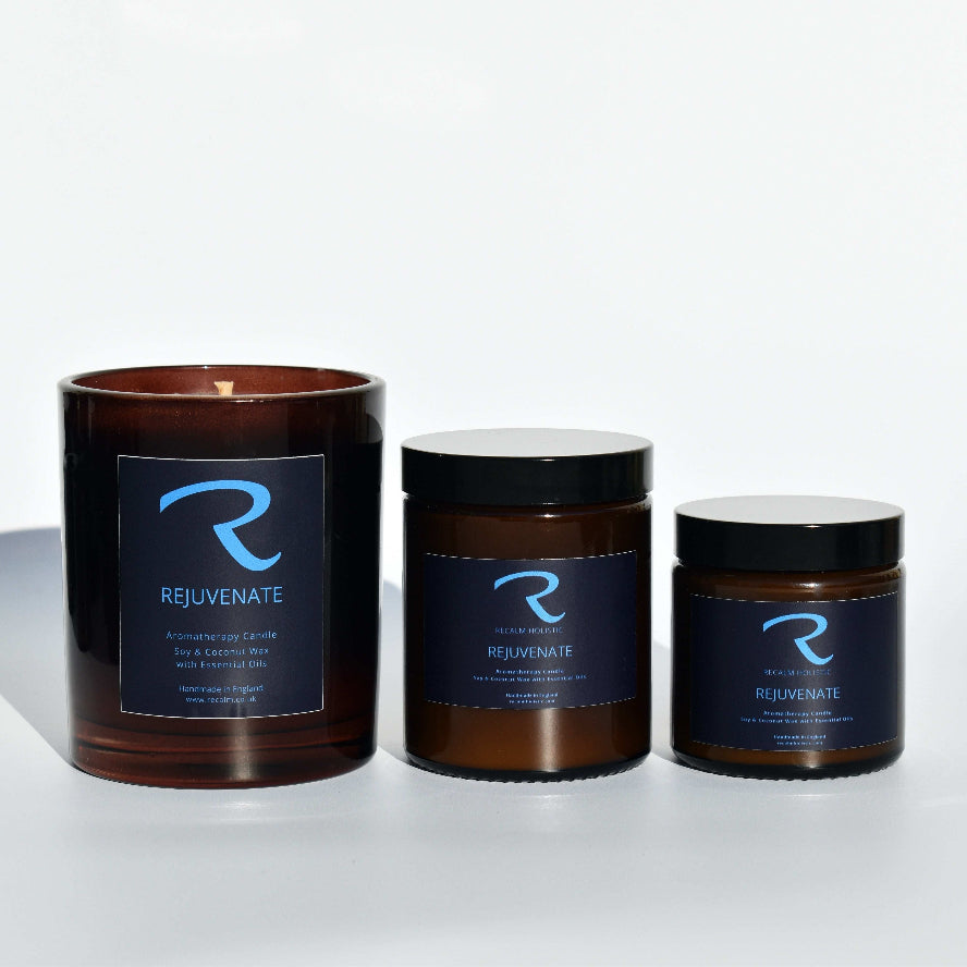 Three 'Rejuvenate' candles of different sizes on a white background Amber Candle Jars, Luxury Cosy vibe