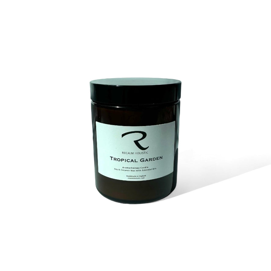 Black candle jar with a label on a white background Tropical Garden on the label