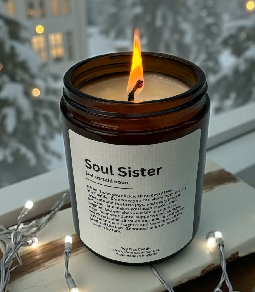Soul Sister Gift, Soul Sister Definition Label on Candle, in cosy home, with Christmas Tree outside, Christmas lights