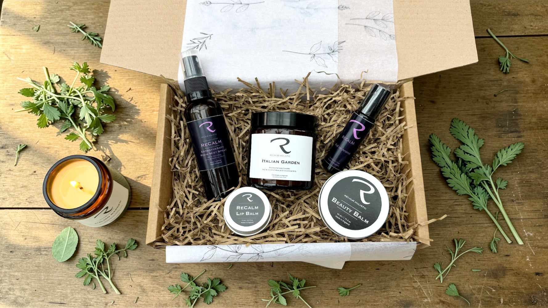 Summer Subscription Box by ReCalm Holistic, featuring Italian Garden Aromatherapy Candle, ReCalm Room Mist Spray, ReCalm Pulse Points for on the go calming body oil, ReCalm Beauty Balm, ReCalm Lip Balm, beautifully presented in a gift presentation box