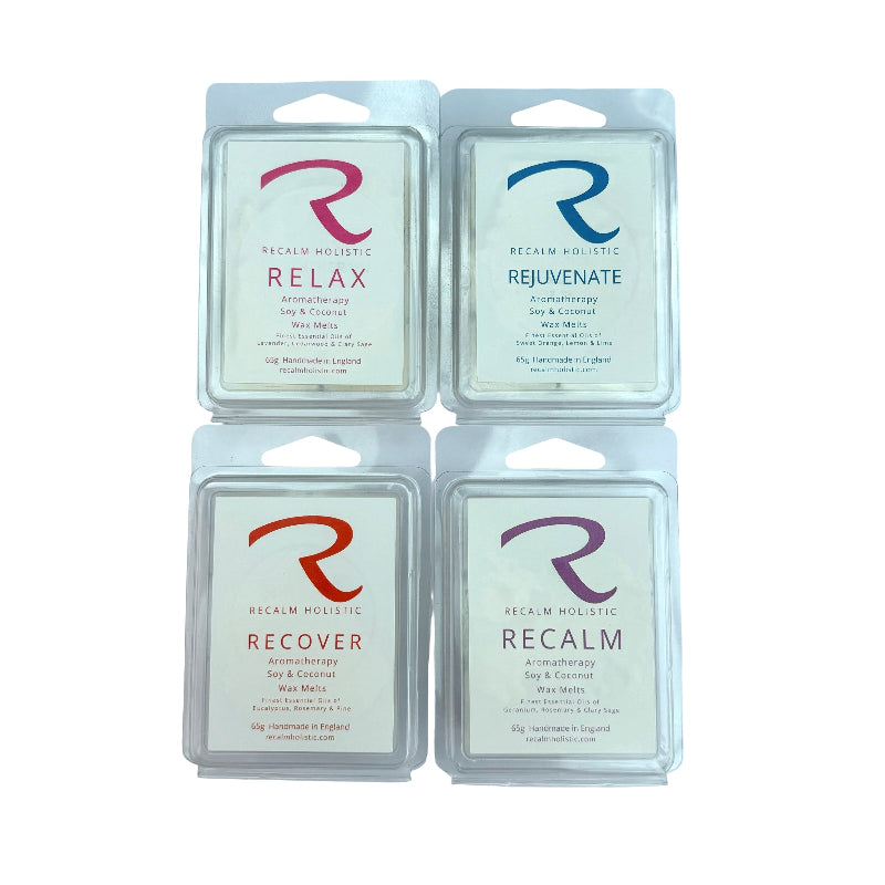 Four packages of Recalm Holistic wax melts with different labels on a white background