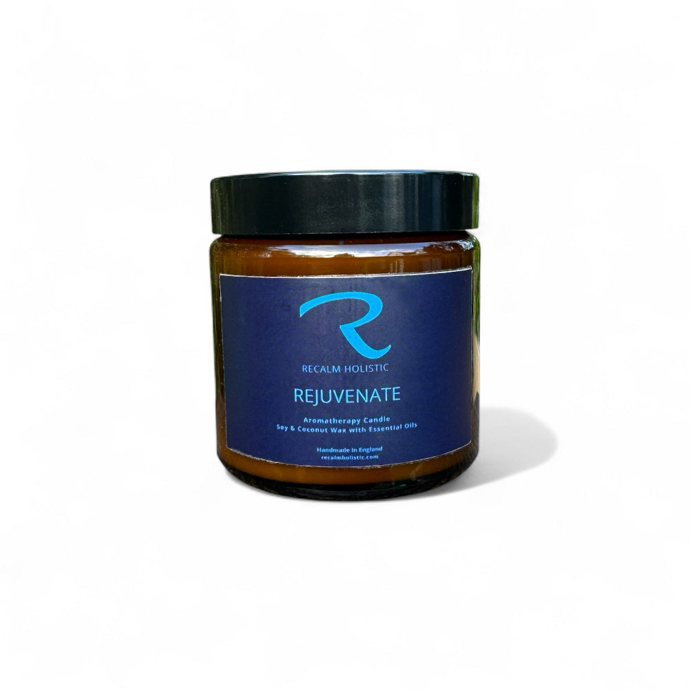 Small 120ml REJUVENATE aromatherapy candle in amber glass jar by Recalm Holistic.