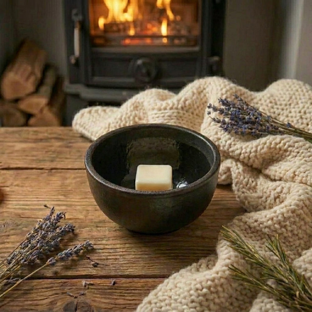 Candle in a black bowl on a wooden table with a fireplace in the background, Wax Melter, Cast Iron Wax Melter for Stove Top
