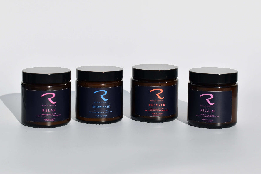 Four jars labeled 'Relax', 'Rejuvenate', 'Recover', and 'Recalm' with brand logo called ReCalm Holistic 