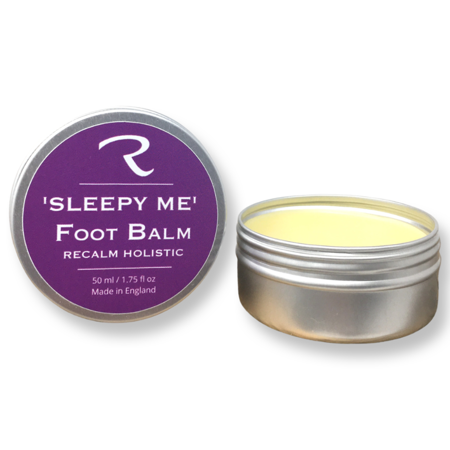 Foot balm container with purple lid and open lid showing balm inside on a white background called Sleepy me