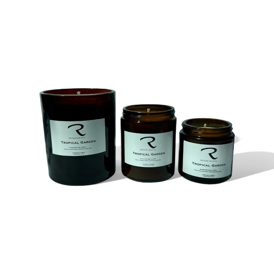 Three candles of different sizes with labels on a white background