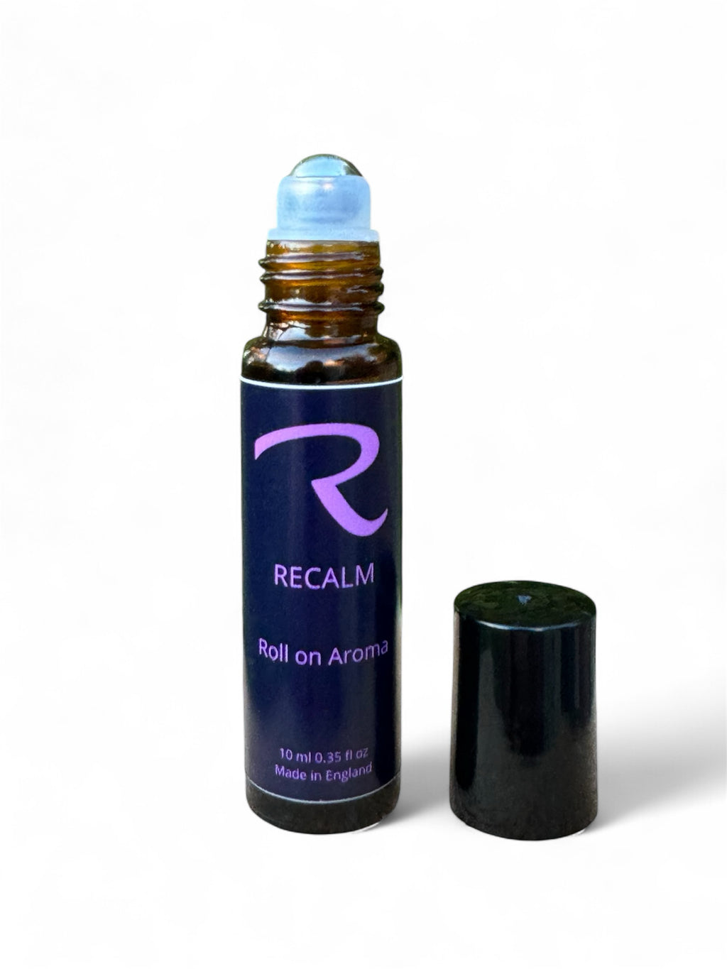 Roll-on aromatherapy glass bottle with steel roller called ReCalm, by ReCalm Holistic, Grounding, Stress Relieving, Spa Blend for Women's health and wellbeing, to help balance emotions, women's balance