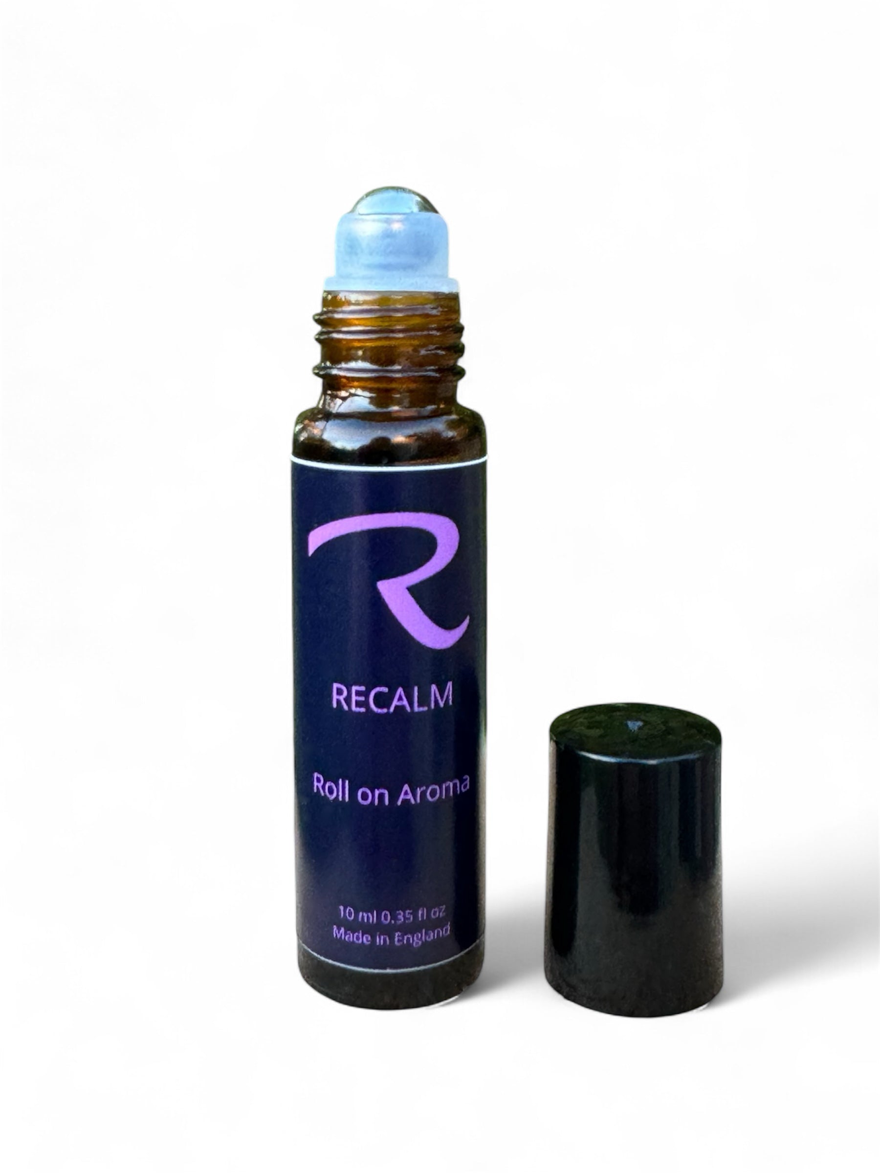 Roll-on aromatherapy glass bottle with steel roller called ReCalm, by ReCalm Holistic, Grounding, Stress Relieving, Spa Blend for Women's health and wellbeing, to help balance emotions, women's balance
