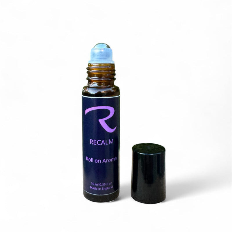 Roll-on aromatherapy glass bottle with steel roller called ReCalm, by ReCalm Holistic, Grounding, Stress Relieving, Spa Blend for Women's health and wellbeing, to help balance emotions, women's balance