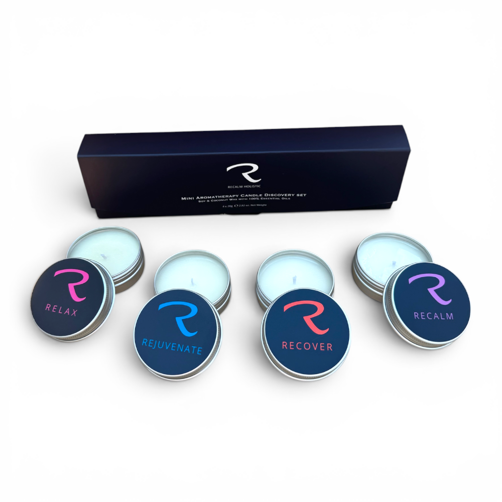 Four natural soy wax aromatherapy tealights from the ReCalm Holistic discovery set featured in a stunning gift presentation box, displaying the Relax, Rejuvenate, Recover, and ReCalm essential oil sample scents.