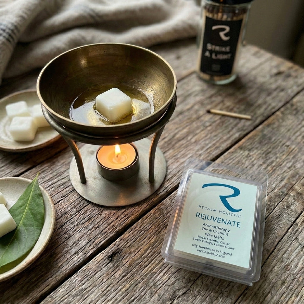 Hand-poured Rejuvenate soy wax melts infused with sweet orange and bergamot pure essential oils for daytime focus.