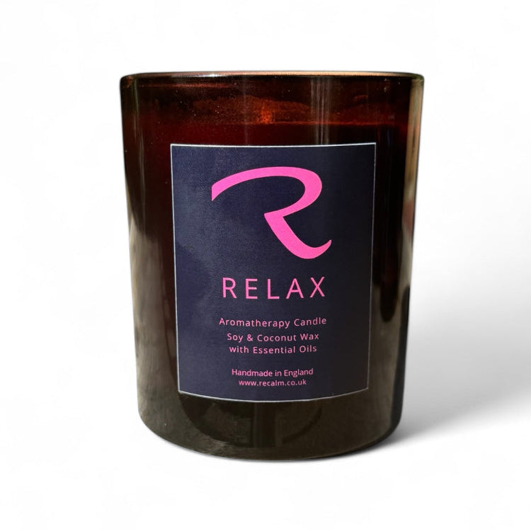 Relax aromatherapy candle creating a calm and peaceful mood by ReCalm Holistic, the finest essential oils candle with Lavender, Cedarwood and Clary Sage, our Sleep Promoting, Meditating, Calming Blend. 100% Natural Aromatherapy Candle in Luxury Amber Spa Glass Vessel