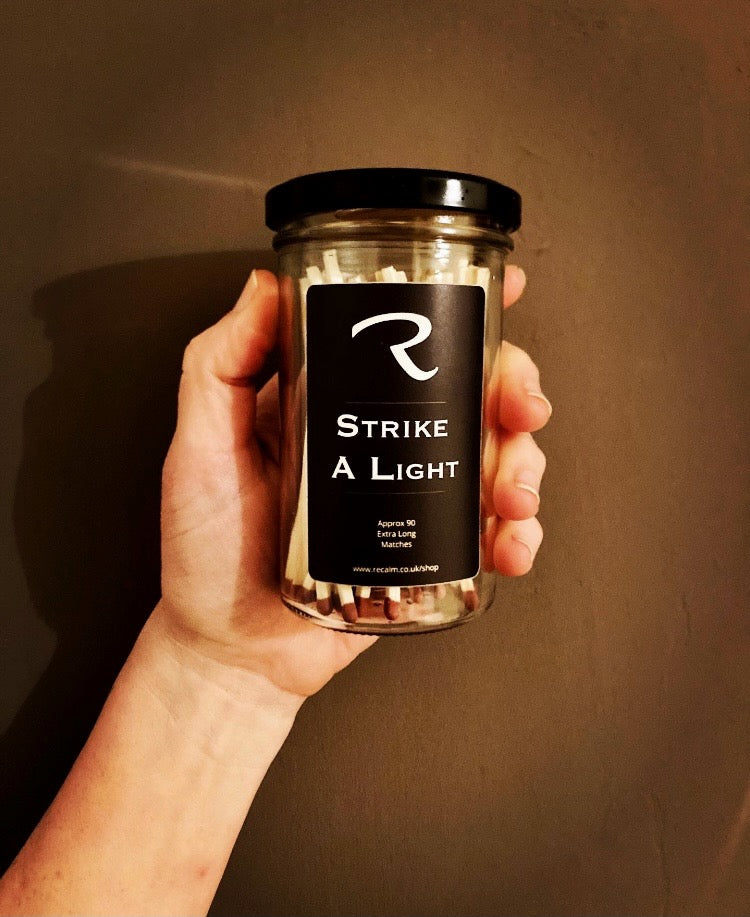 The original Strike a Light luxury wooden candle matches in a refillable glass jar with a built-in strike strip by ReCalm Holistic.