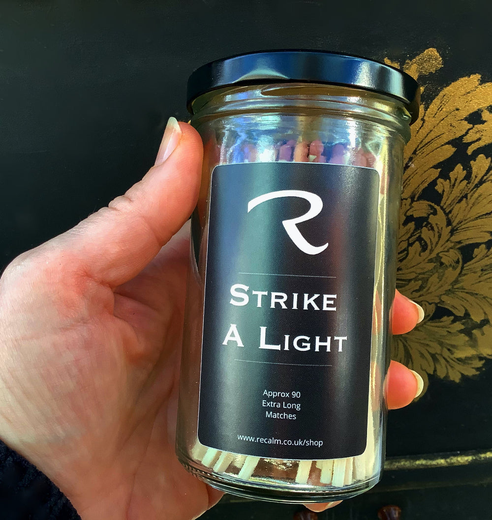 A whimsical and nostalgic display of Strike a Light extra long wooden candle matches in a decorative glass jar by ReCalm Holistic.